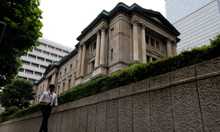 A man walks past Bank of Japan's headquarters in Tokyo on June 17, 2022. (Kim Kyung-Hoon/Reuters)