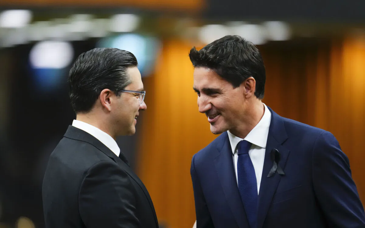 Prime Minister Justin Trudeau and Conservative Leader Pierre Poilievre greet each other as MPs gather in the House of Commons to pay tribute to Queen Elizabeth II, in Ottawa on Sept. 15, 2022. (The Canadian Press/Sean Kilpatrick)