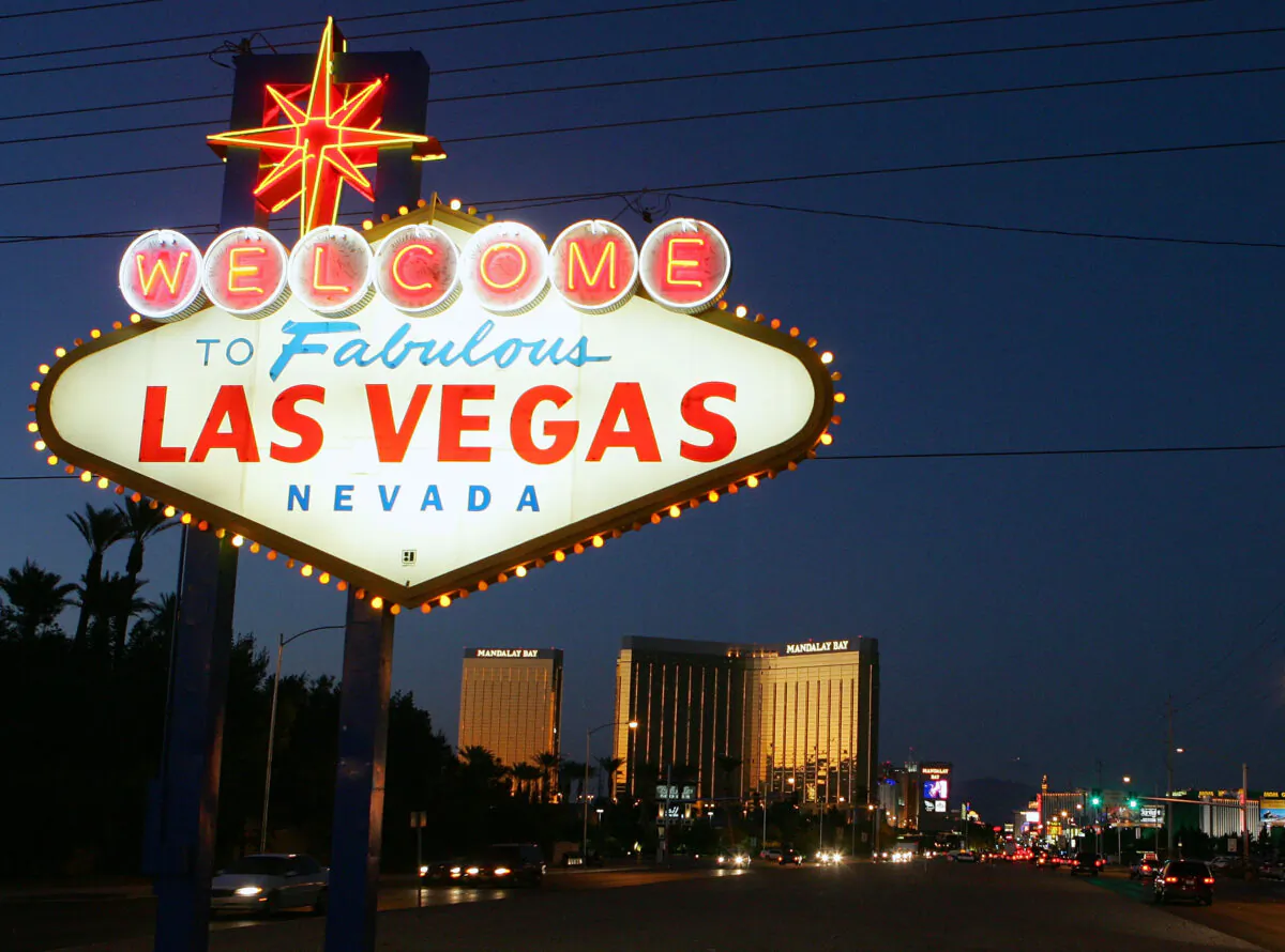 Traffic passes by the famous sign welcoming motorists on the south end of the Las Vegas Strip, in Las Vegas, Nev., on Nov. 11, 2005. (Ethan Miller/Getty Images)