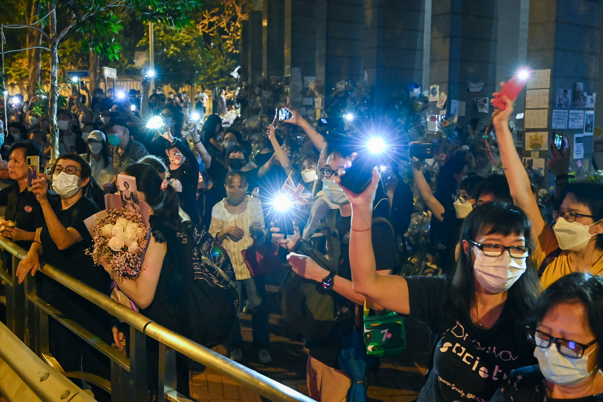 HK People Mourn the Queen Unabated Outside UK Consulate With One Arrested for Playing the British National Anthem - Vimarsana News
