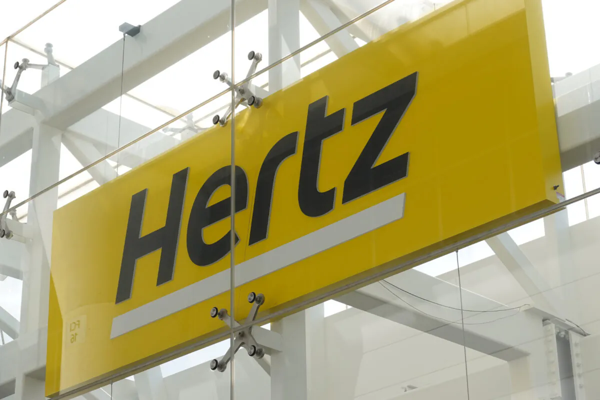Signage at Hertz rental car at John F. Kennedy International Airport in Queens, New York, on March 30, 2022. (Andrew Kelly/Reuters)