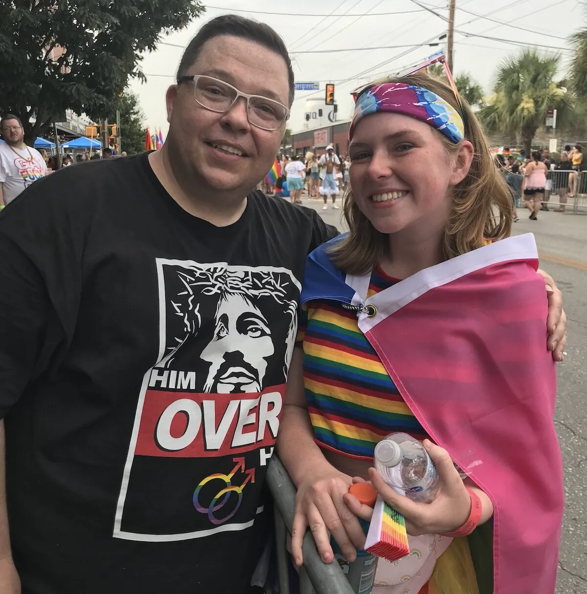 Kevin Whitt (L), a former drag performer, interacts with an LGBT activist while evangelizing at a gay pride parade. (Photo courtesy of Kevin Whitt)