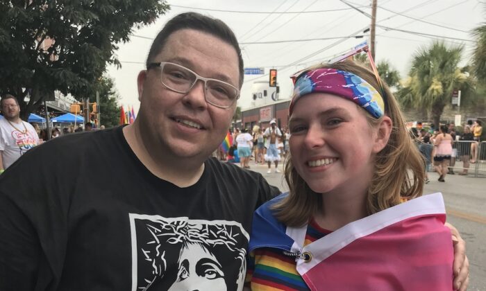Kevin Whitt (L), a former drag performer, interacts with an LGBT activist while evangelizing at a gay pride parade. (Photo courtesy of Kevin Whitt)