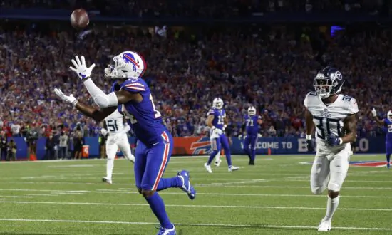 Diggs Scores 3 TDs for Bills in 41–7 Rout of Titans