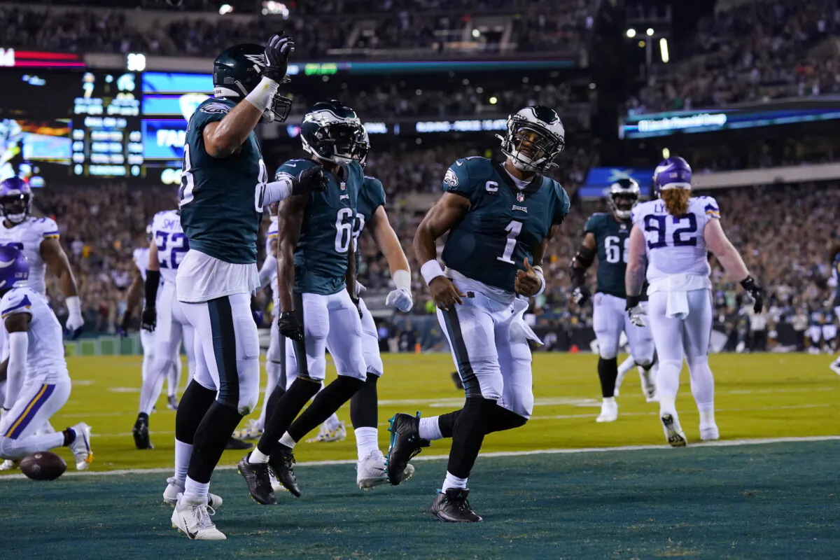 Philadelphia Eagles quarterback Jalen Hurts (1) celebrates after scoring on a 26-yard touchdown run during the first half of an NFL football game against the Minnesota Vikings, Monday, Sept. 19, 2022, in Philadelphia. (AP Photo/Matt Rourke)
