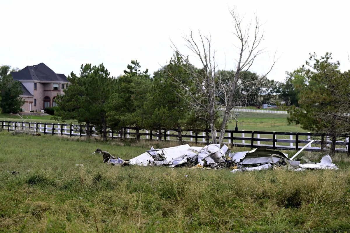 A crashed plane, one of two, lies along Niwot Road between Highway 287 and N. 95th St. in Longmont, Colo., on Sept. 17, 2022. (Andy Cross/The Denver Post via AP)
