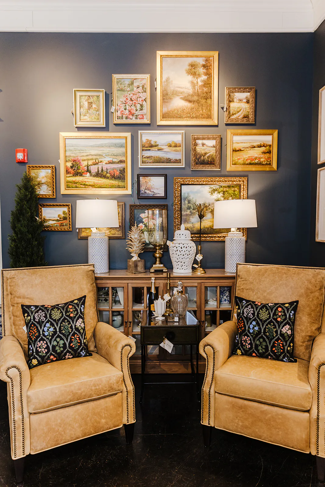 Two stately buttery leather chairs flank a gallery wall. (Handout/TNS)