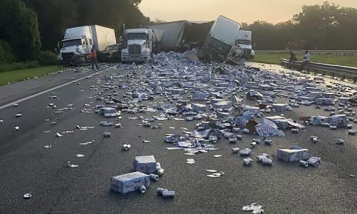 Cases of Coors Light beer are strewn across a highway after two semitrailers collided on a Florida highway near Brooksville, Fla., on Sept. 21, 2022. (Florida Highway Patrol via AP)