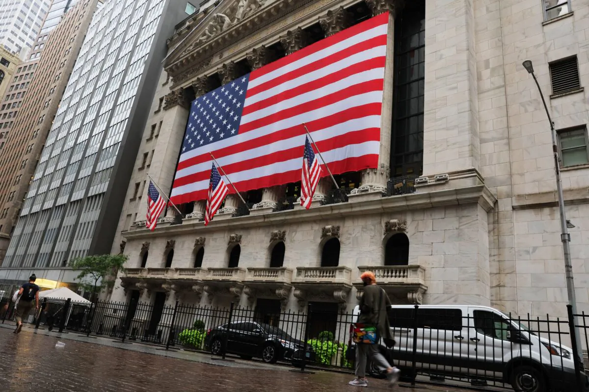 People walk past the New York Stock Exchange before the start of morning trading in New York City on Sept. 6, 2022. (Michael M. Santiago/Getty Images)