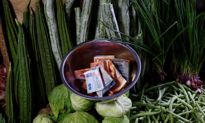 Sri Lankan rupees in a bowl at a vegetable vendor's shop amid the rampant food inflation, amid Sri Lanka's economic crisis, in Colombo, Sri Lanka, on July 29 , 2022. (Kim Kyung-Hoon/Reuters)