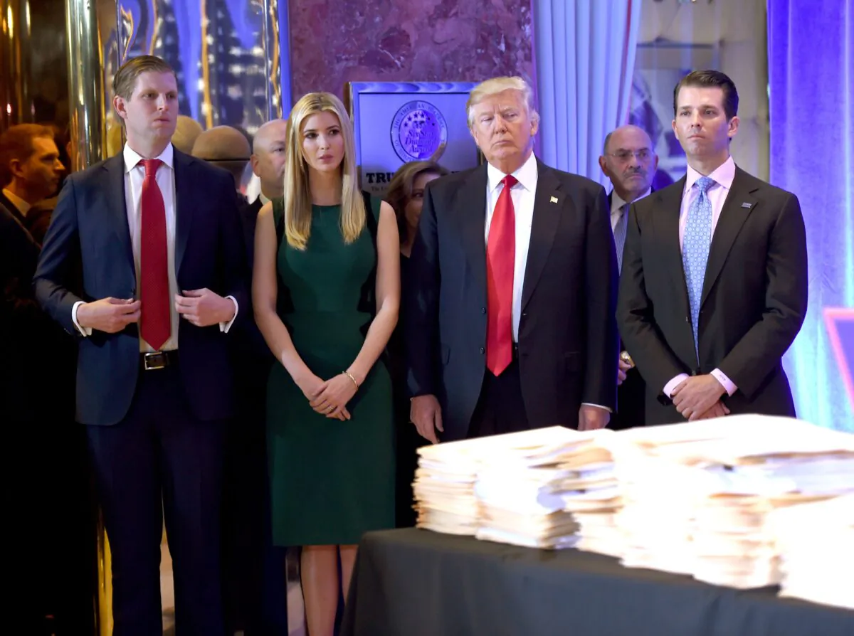 President-elect Donald Trump (2nd R) along with his children Eric (L), Ivanka (2nd L), and Donald Jr. (R) arrive for a press conference at Trump Tower in New York, on Jan. 11, 2017. (Timothy A. Clary/AFP via Getty Images)
