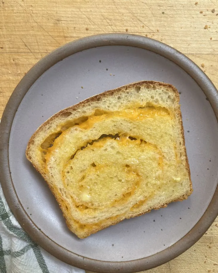 Tear into this simple bread and you'll be delighted to find a gorgeous swirl of cheese baked in the center of the loaf. (Patty Catalano/TNS)
