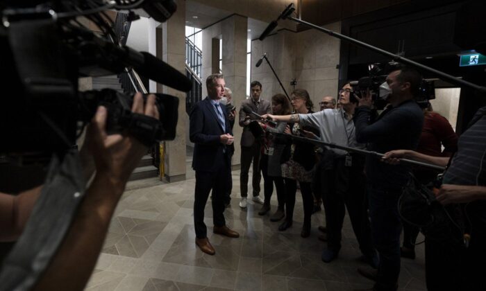 Conservative MP for Leeds-Grenville-Thousand Islands and Rideau Lakes Michael Barrett speaks with media before attending caucus, in Ottawa, Sept. 21, 2022. (The Canadian Press/Adrian Wyld)