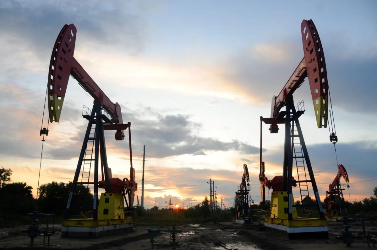 Pumpjacks are seen during sunset at the Daqing oil field in Heilongjiang Province, China, on Aug. 22, 2019. (Stringer/Reuters)