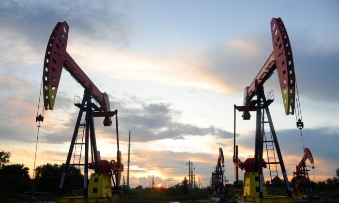 Pumpjacks are seen during sunset at the Daqing oil field in Heilongjiang Province, China, on Aug. 22, 2019. (Stringer/Reuters)