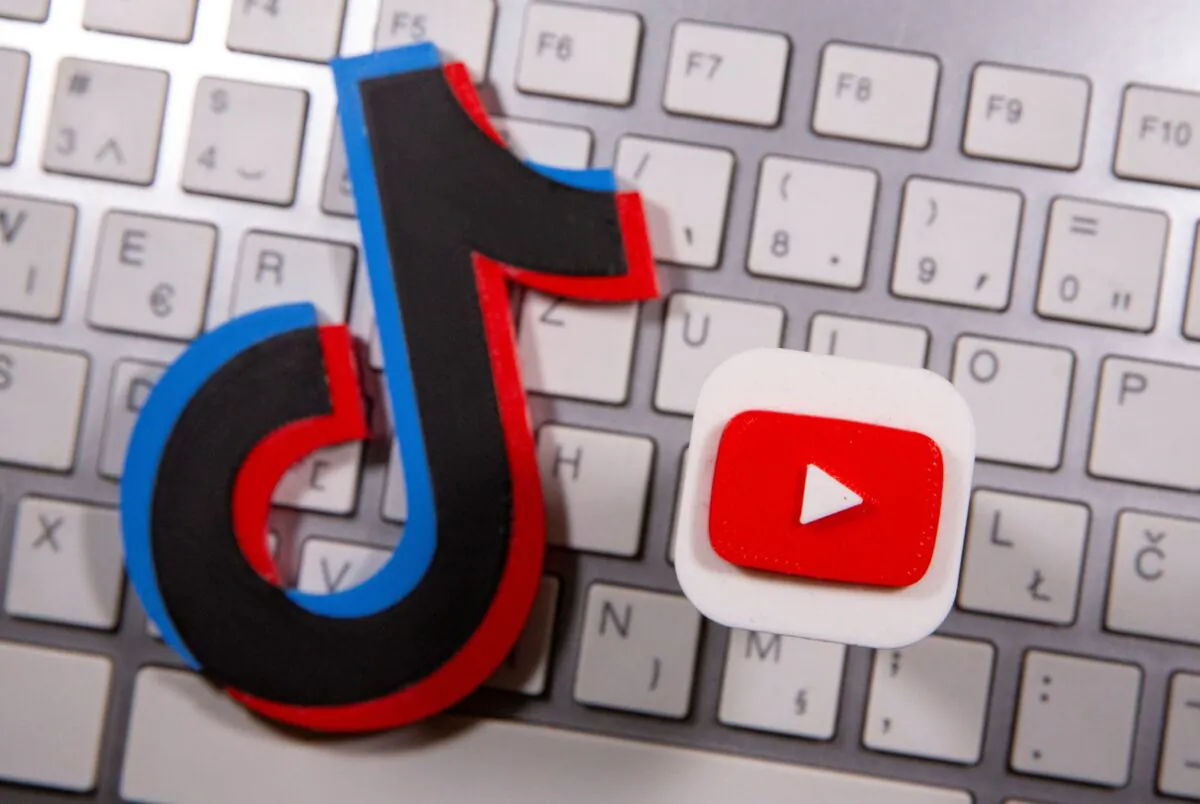 A 3D printed Youtube and TikTok logo placed on keyboard on Sept. 15, 2020. (Dado Ruvic/Reuters)