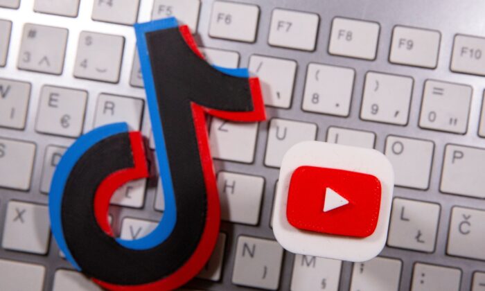 A 3D printed Youtube and Tik Tok logo placed on keyboard on Sept. 15, 2020. (Dado Ruvic/Reuters)