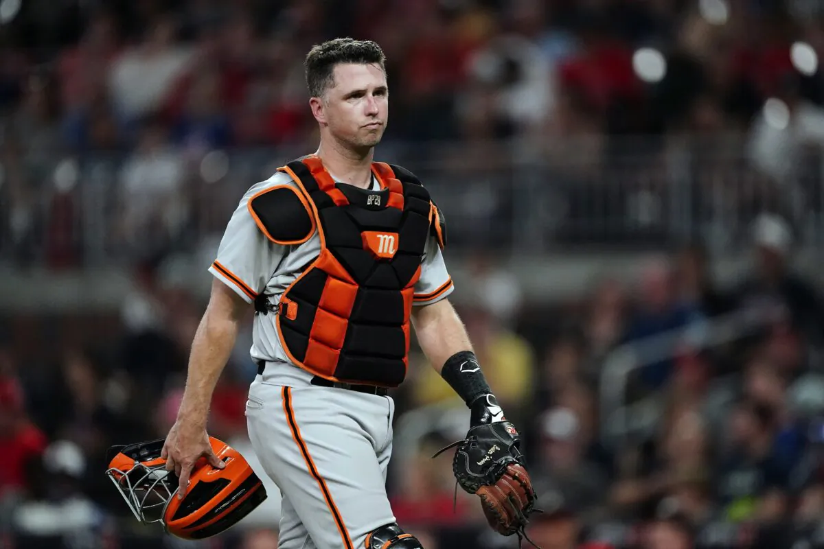 San Francisco Giants catcher Buster Posey walks on the field during the team's baseball game against the Atlanta Braves in Atlanta on Aug. 27, 2021. (John Bazemore/AP Photo)