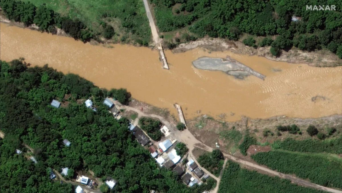 A flooded bridge in the aftermath of Hurricane Fiona, in Arecibo, Puerto Rico, on Sept. 21, 2022. (Courtesy of 2022 Maxar Technologies/Handout via Reuters)