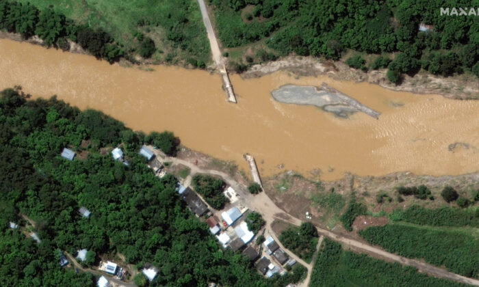 A flooded bridge in the aftermath of Hurricane Fiona, in Arecibo, Puerto Rico, on Sept. 21, 2022. (Courtesy of 2022 Maxar Technologies/Handout via Reuters)