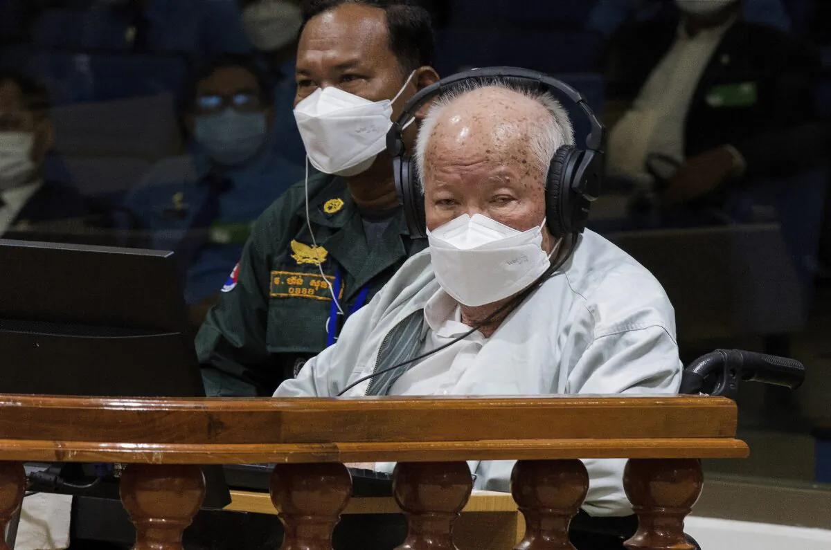 Khieu Samphan (R), the former head of state for the Khmer Rouge, sits in a courtroom during a hearing at the U.N.-backed war crimes tribunal in Phnom Penh, Cambodia, on Sept. 22, 2022. (Nhet Sok Heng/Extraordinary Chambers in the Courts of Cambodia via AP)