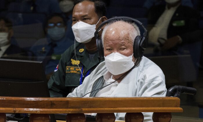 Khieu Samphan (R), the former head of state for the Khmer Rouge, sits in a courtroom during a hearing at the U.N.-backed war crimes tribunal in Phnom Penh, Cambodia, on Sept. 22, 2022. (Nhet Sok Heng/Extraordinary Chambers in the Courts of Cambodia via AP)