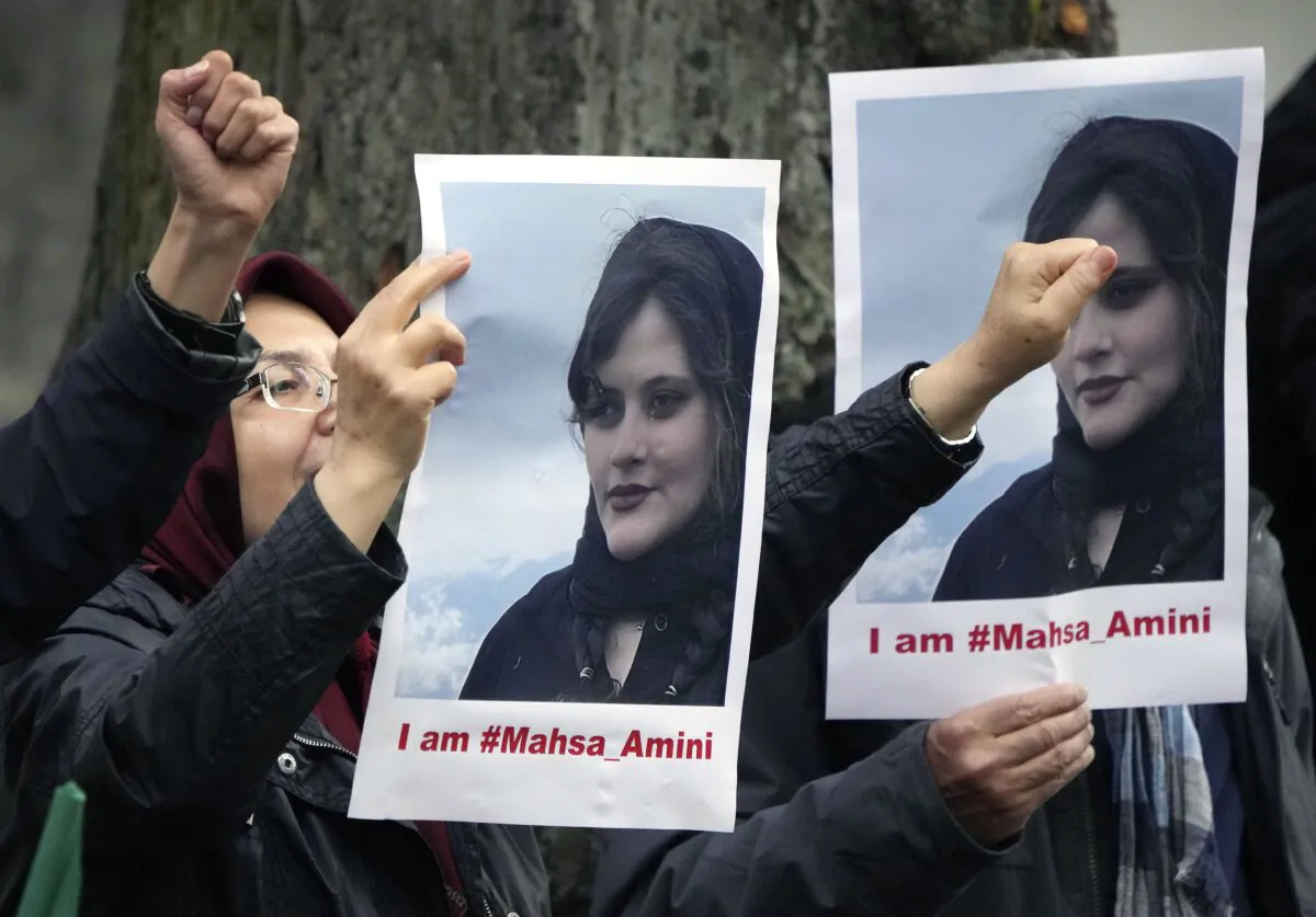 Exile Iranians of the National Council of Resistance of Iran gather in front of the embassy of Iran in Berlin, Germany, on Sept. 20, 2022, after the death of an Iranian woman held by the country's morality police. (Michael Sohn/AP Photo)