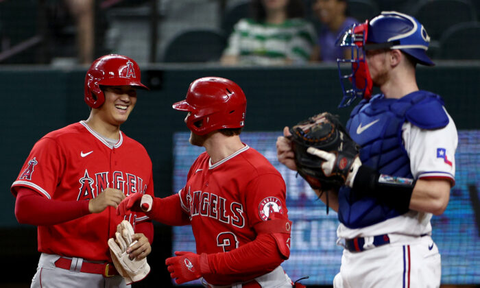 Taylor Ward (3) of the Los Angeles Angels celebrates with Shohei Ohtani (17) of the Los Angeles Angels after hitting a two-run home run against the Texas Rangers in the top of the first inning at Globe Life Field in Arlington, Texas, on Sept. 21, 2022. (Tom Pennington/Getty Images)