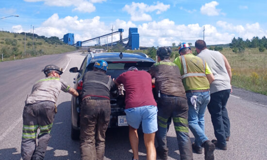 Coal Miners Help Couple After Their Electric Car Runs Out of Battery Right Outside the Mine