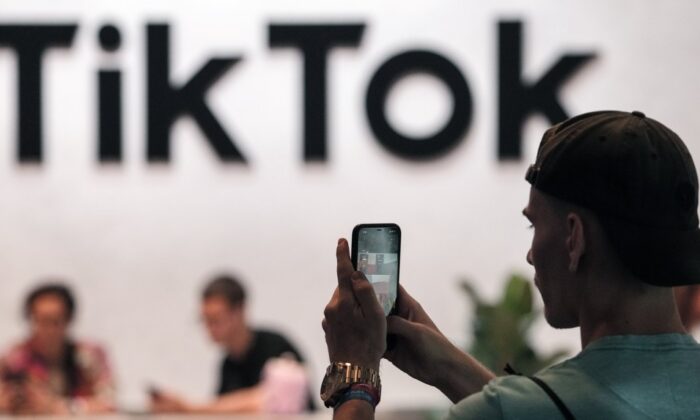 A visitor makes a photo at the TikTok exhibition stands at the Gamescom computer gaming fair in Cologne, Germany, on Aug. 25, 2022.(The Canadian Press/AP, Martin Meissner)