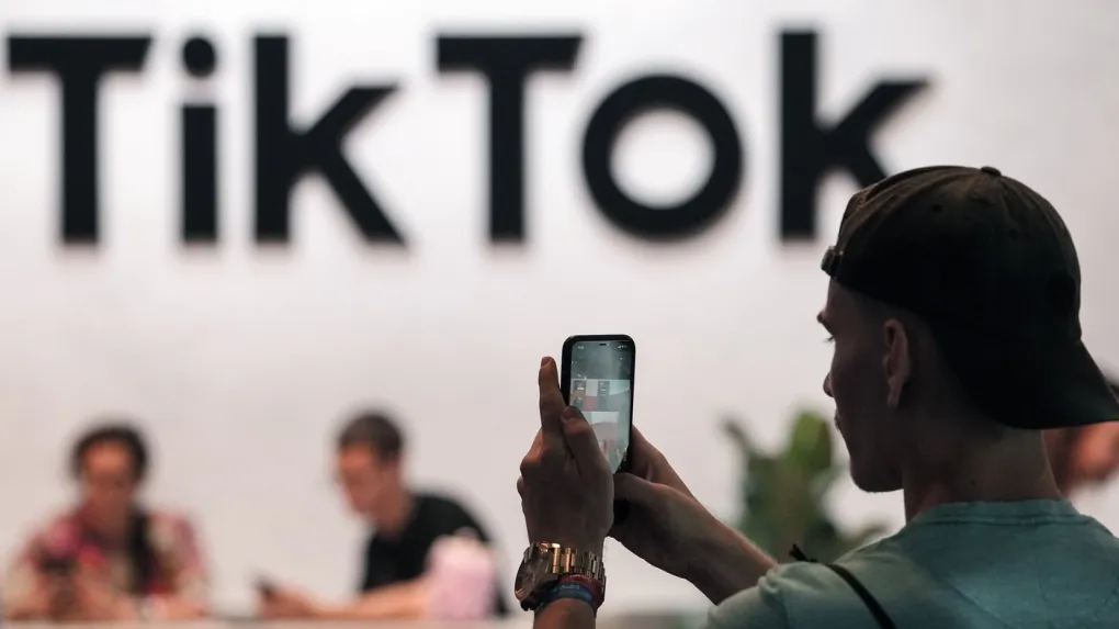 A visitor makes a photo at the TikTok exhibition stands at the Gamescom computer gaming fair in Cologne, Germany, on Aug. 25, 2022.(The Canadian Press/AP, Martin Meissner)