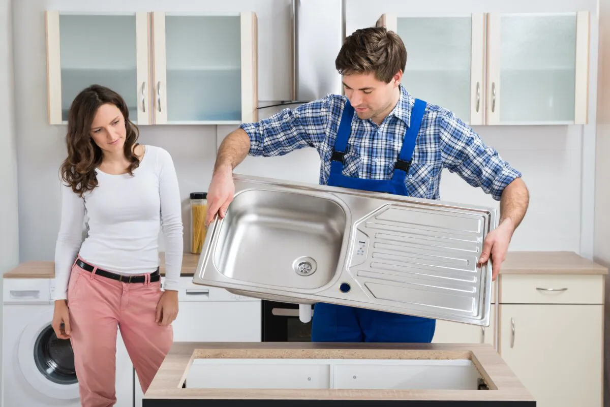 Top-mount stainless steel sinks are something you can install yourself, once you understand a few simple key considerations. (Andrey_Popov/Shutterstock)