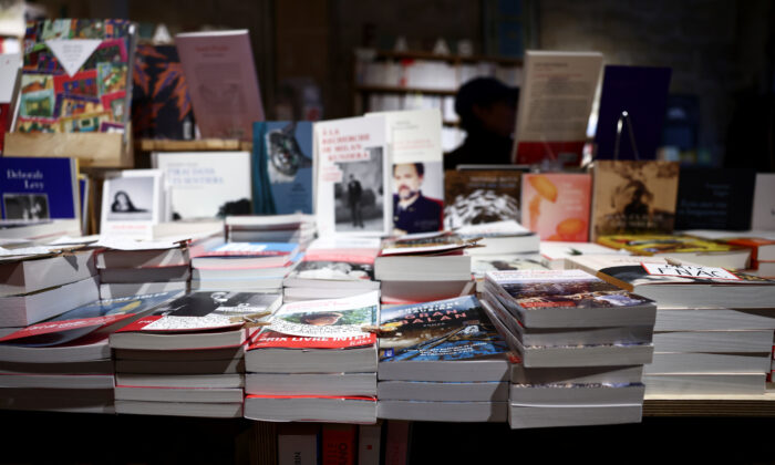 Books are displayed on a table at "La Librairie du Canal" bookstore in Paris on Oct. 21, 2021. (Reuters/Sarah Meyssonnier