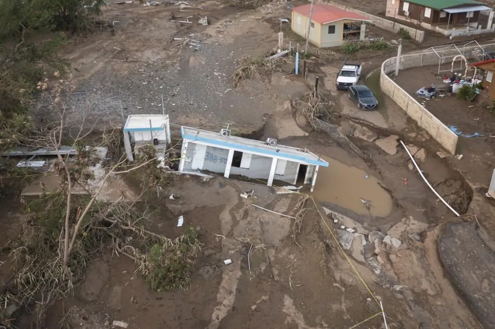 A view of a house that was washed away by Hurricane Fiona at Villa Esperanza in Salinas, Puerto Rico, is shown on Sept 21, 2022. (The Canadian Press/Alejandro Granadillo)