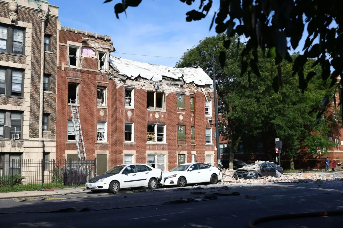 Fire crews respond to the scene of an explosion inside a building on Sept. 20, 2022, in Chicago.  (Anthony Vazquez/Chicago Sun-Times via AP)
