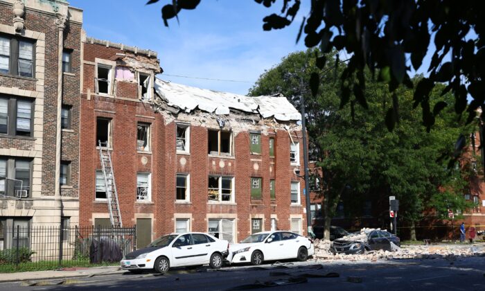 Fire crews respond to the scene of an explosion inside a building on Sept. 20, 2022, in Chicago.  (Anthony Vazquez/Chicago Sun-Times via AP)