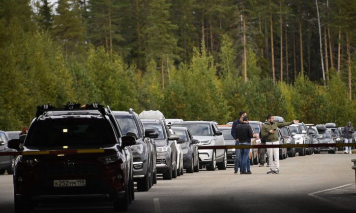Cars coming from Russia wait in long lines at the border checkpoint between Russia and Finland near Vaalimaa, on Sept. 22, 2022. (Olivier Morin/AFP via Getty Images)