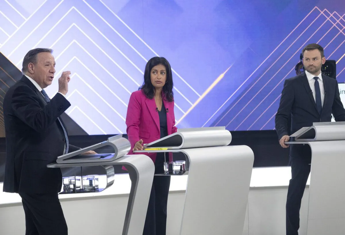 CAQ Leader Francois Legault gestures toward Liberal Leader Dominique Anglade and Parti Quebecois Leader Paul St-Pierre Plamondon during a leaders debate in Montreal, Sept. 22, 2022. (The Canadian Press/Ryan Remiorz)