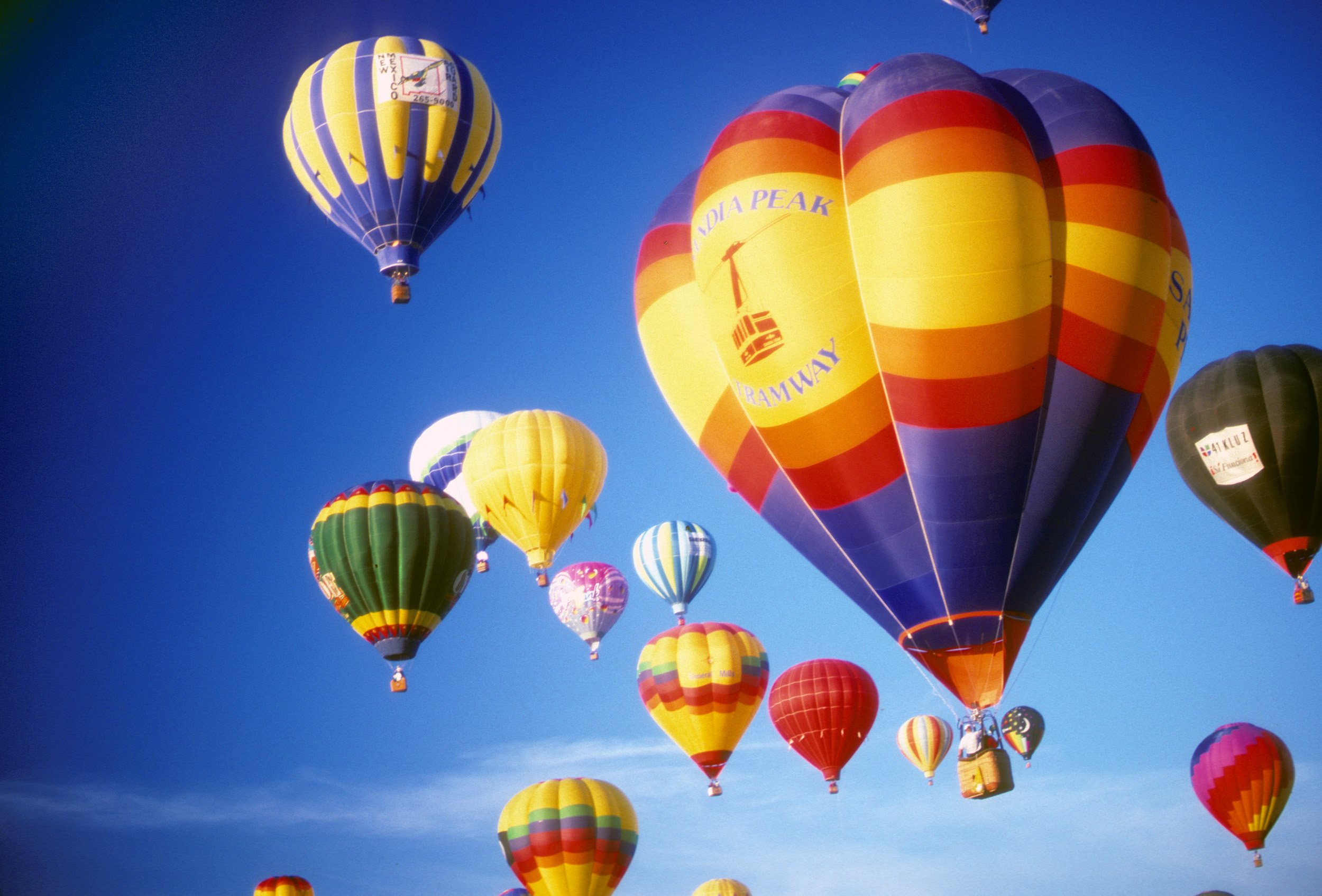 Hot air balloons against blue sky