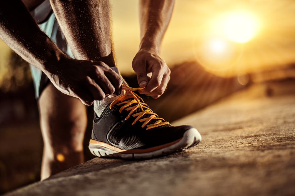 Man,Tying,Jogging,Shoes