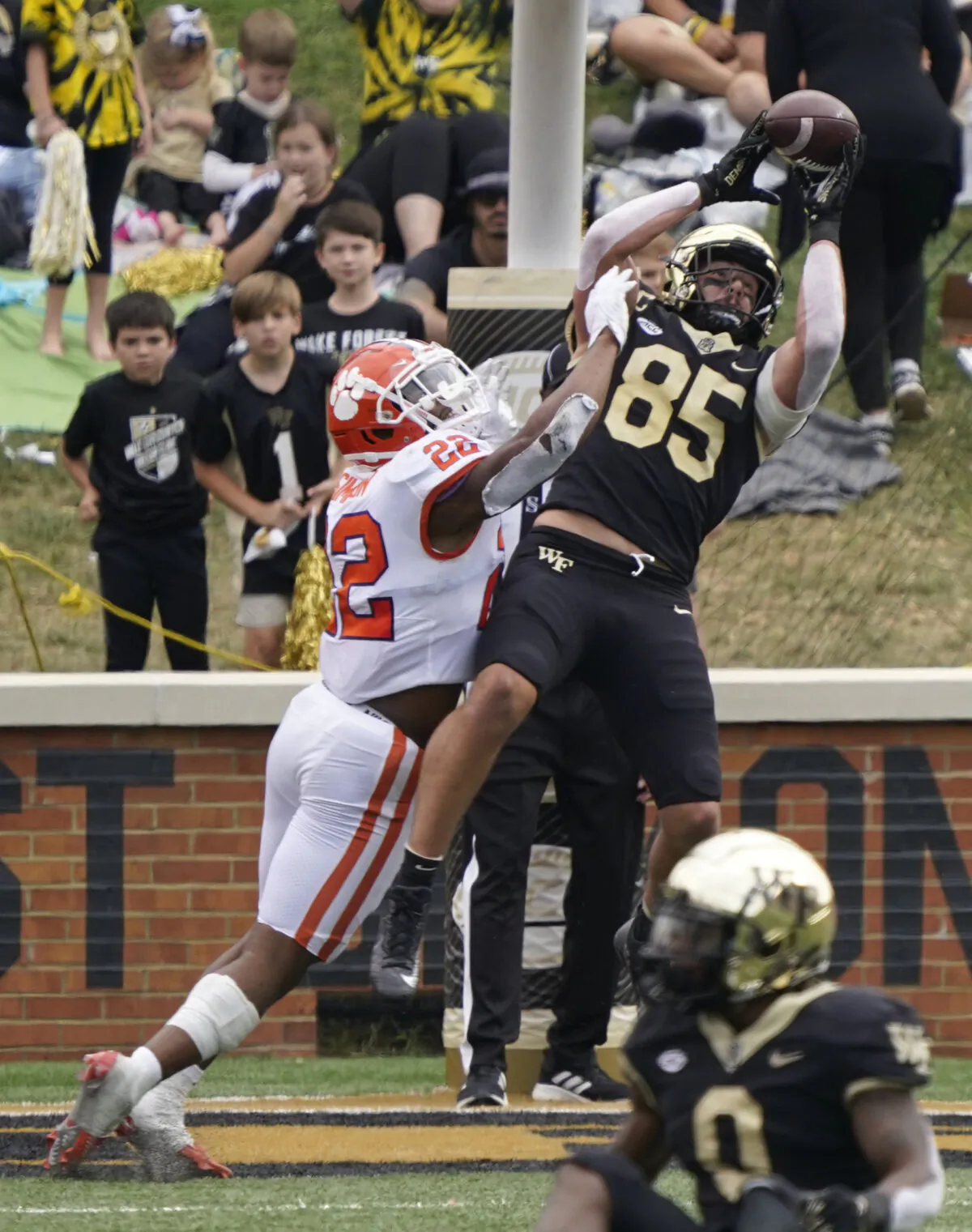 Wake Forest tight end Blake Whiteheart (85) catches a touchdown pass against Clemson linebacker Trenton Simpson (22) during the second half of an NCAA college football game in Winston-Salem, N.C., on Sept. 24, 2022. (Chuck Burton/AP Photo)