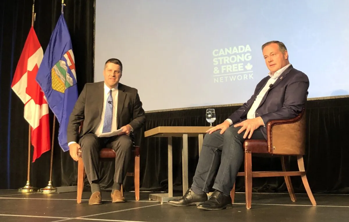 Alberta Premier Jason Kenney (R) talks to host Sean Speer at the Canada Strong and Free Networking Conference at the Cambridge Hotel & Conference Centre in Red Deer, Alta., on Sept. 24, 2022. (Noé Chartier/The Epoch Times)