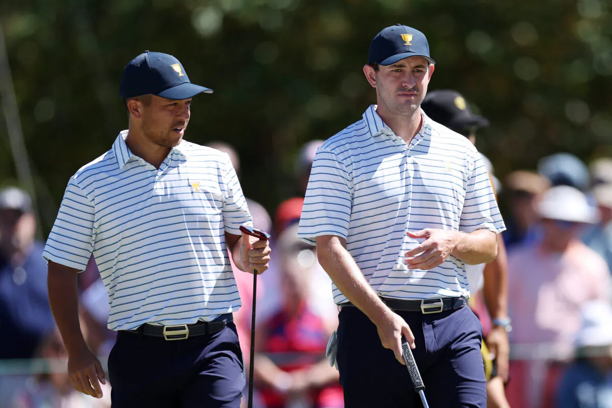 Patrick Cantlay (R) and Xander Schauffele of the United States Team of the United States Team look on from the fifth hole during Friday four-ball matches on day two of the 2022 Presidents Cup at Quail Hollow Country Club in Charlotte, N.C., on Sept. 23, 2022. (Rob Carr/Getty Images)