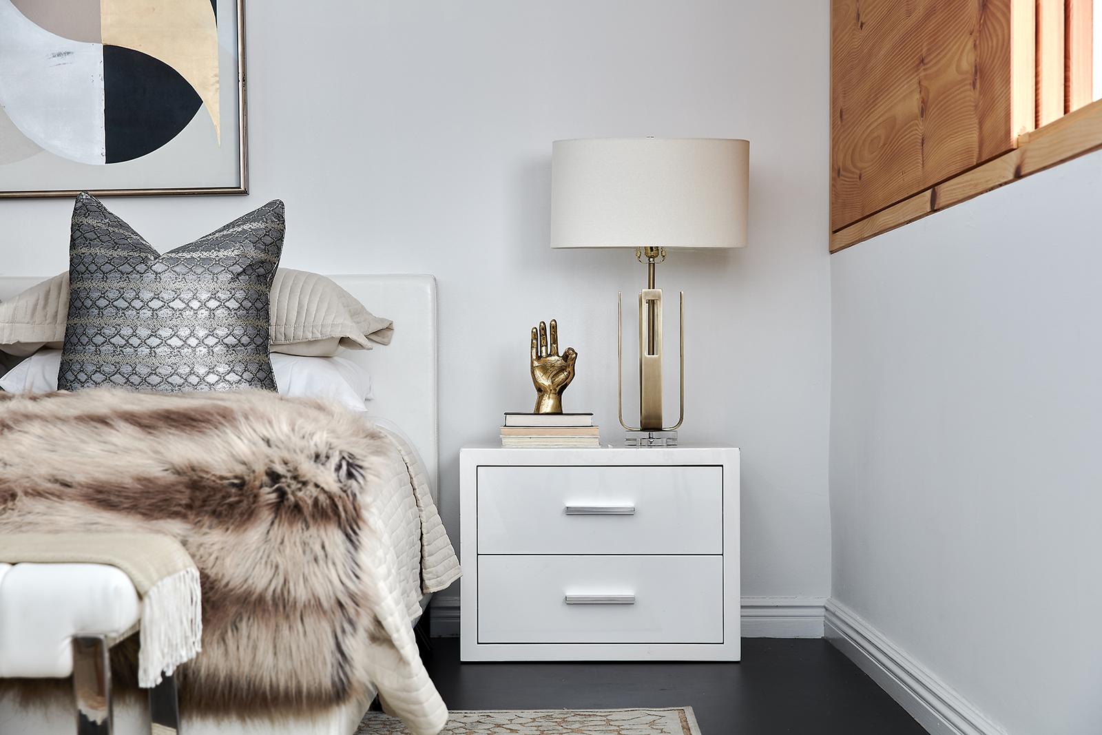 Black and mauve artwork is highlighted by metallic accents in gold and silver.