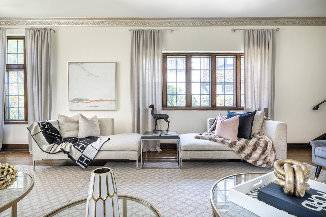 A neutral foundation of cream and gray is accented by mauve and black accents including artwork. (Handout/TNS)
