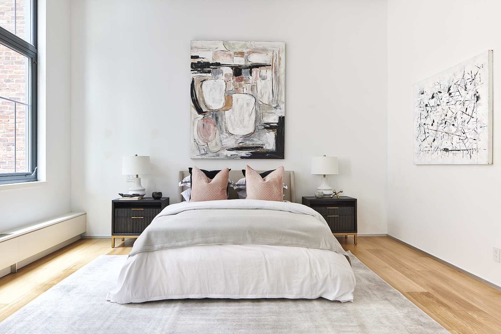 An oversized piece of art, serves as inspiration for a dominant black and mauve color palette.