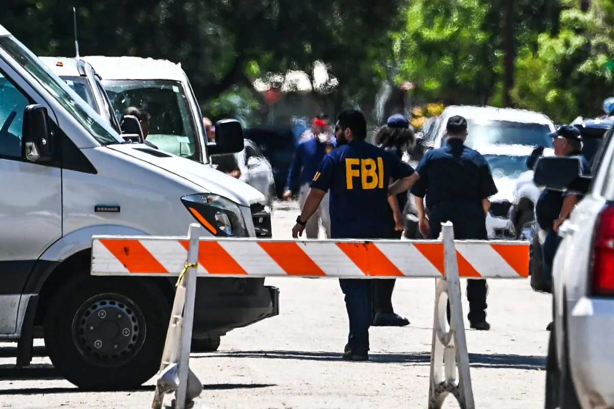 An FBI agent outside Robb Elementary School in Uvalde, Texas, on May 25, 2022. (Chandan Khanna/AFP via Getty Images)