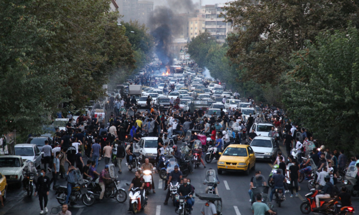 A picture obtained by AFP outside Iran on Sept. 21, 2022, shows Iranian demonstrators taking to the streets of the capital Tehran during a protest for Mahsa Amini, days after she died in police custody. (AFP via Getty Images)