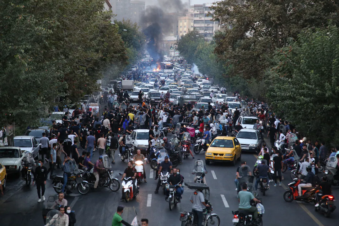 A picture obtained by AFP outside Iran on Sept. 21, 2022, shows Iranian demonstrators taking to the streets of the capital Tehran during a protest for Mahsa Amini, days after she died in police custody. (AFP via Getty Images)