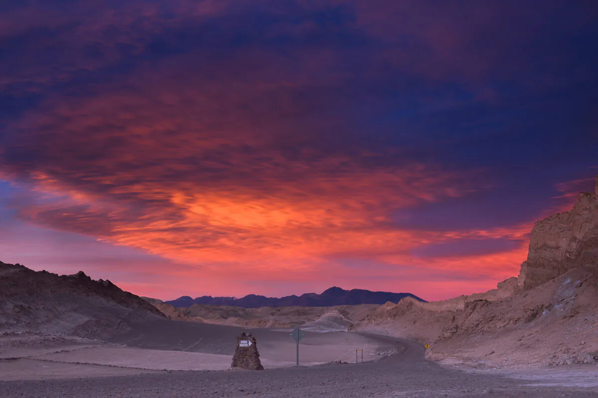 The sun sets over a road in Chile's Atacama Desert. (Samuel Cohen/Dreamstime/TNS)